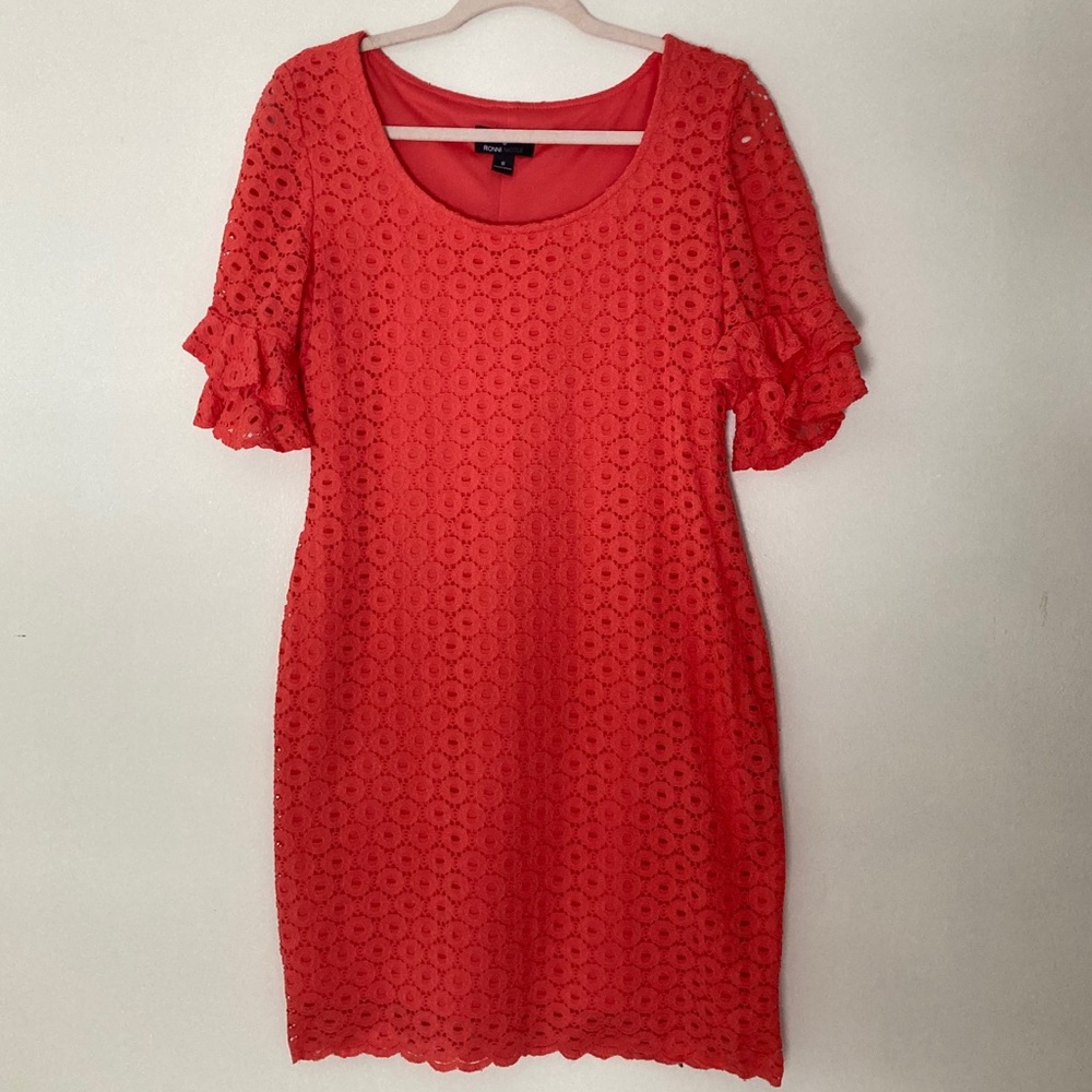 Coral eyelet dress with ruffled sleeves